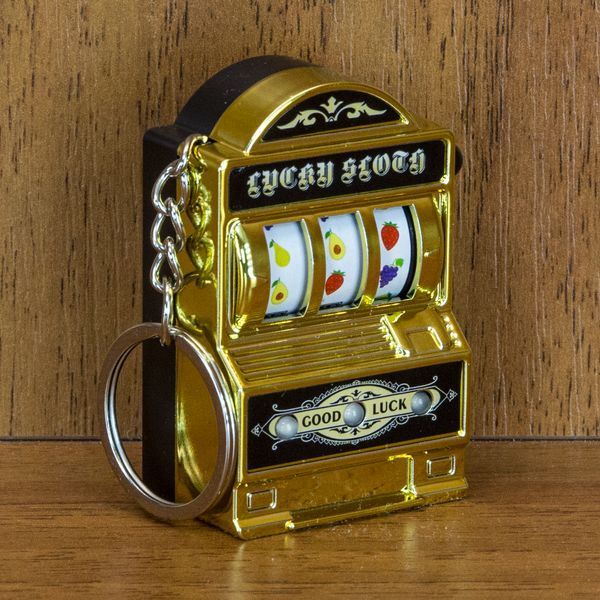 Брелок у вигляді казино &laquo;Однорукий бандит&raquo; з музикою (золотий)